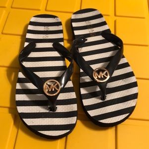 Michaels Kors black/white stripe flip flop. Size6